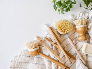 Dish washing brushes, bamboo toothbrushes, bamboo towel. Sustainable lifestyle zero waste concept....
