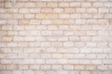 Brick wall background. Closed up texture of a vintage brick wall with ribbon hanging from the top.