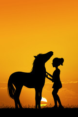 Fototapeta na wymiar little girl and horse at sunset