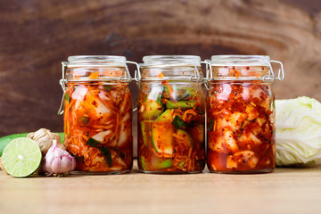 Kimchi cabbage, cucumber and radish in a jar, Korean food - obrazy, fototapety, plakaty