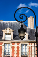 Fototapeta na wymiar Close up on street lamps of Place des Vosges during Autumn in Paris,The Place des Vosges the oldest planned square in Paris, France.