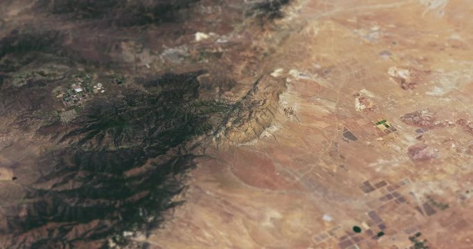 Very high-altitude circular tracking shot of Cameron Ridge, San Joaquin Valley, Mojave Desert, with tilt-shift effect. Reversible, seamless loop. Elements of this image furnished by NASA