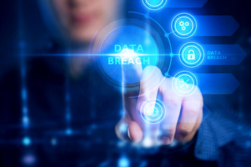 Fototapeta premium The concept of business, technology, the Internet and the network. A young entrepreneur working on a virtual screen of the future and sees the inscription: data breach.