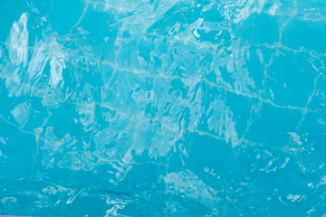 Top view of clear blue water surface on the pool.