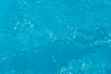 Top view of clear blue water surface on the pool.