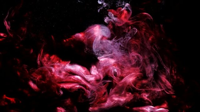 Fluid burst animation. Explosion smog. Red purple smoke motion on black background.