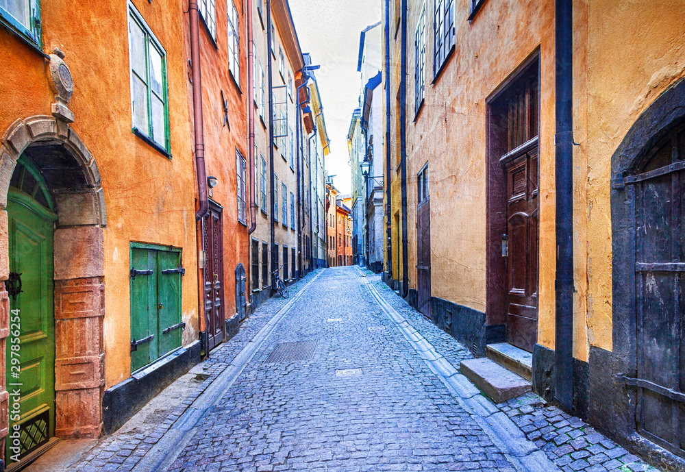 Wall mural charming colorfu narrow streets of old town in stockholm, sweeden