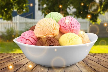 Ice cream scoops in bowl on white background