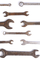 Old rusty stainless steel crescent wrench isolated on white top view