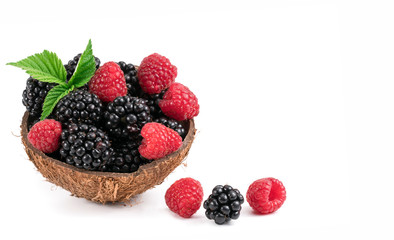 Raspberries and blackberries on white background.