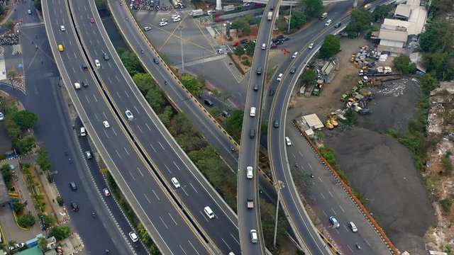 Aerial over Tomang Interchange with flowing traffic, Jakarta, Dolly Out