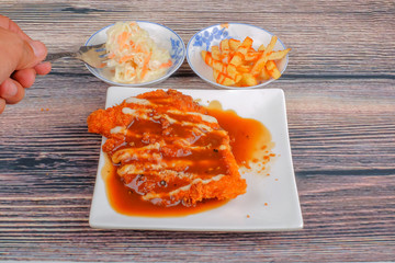 Chicken chop in white plate , coleslaw and french fries  on wood background