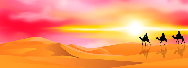 Naklejka na ściany i meble Camel caravan in the desert at sunset. Camel riders in a sandy desert. Caravan on a sunset background
