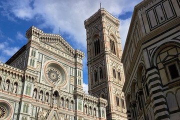 Detail of the facade of the Basilica di Santa Maria del Fiore (Florence Cathedral or Cathedral of Saint Mary of the flower), the main church of Florence, Italy. Bottom view.