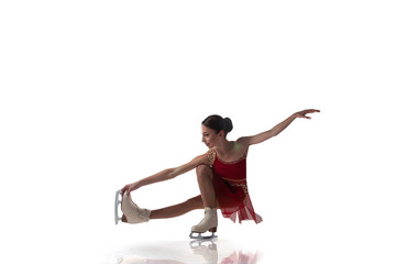 Figure skating girl isolated on white.