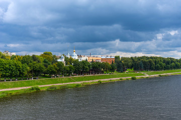 Fototapeta premium Summer panoramic view of the embankment of Volga River with the Church of the Three Confessors in Tver, Russia.