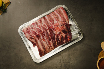 Raw pork ribs on steel plate
