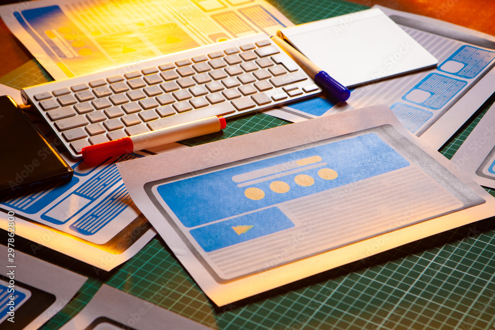 Poster application mockups on the table. programmer's desktop. page-proofs layouts for sites. idea of the a