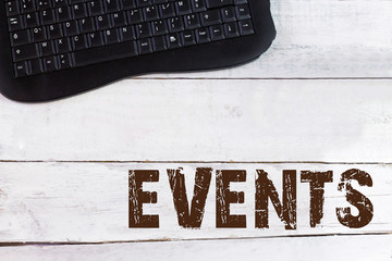 EVENTS on wooden table