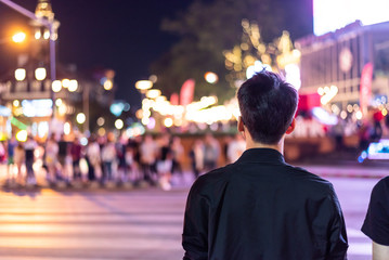 Peoples walking  crossing the street at city night , Chiang mai , Thailand