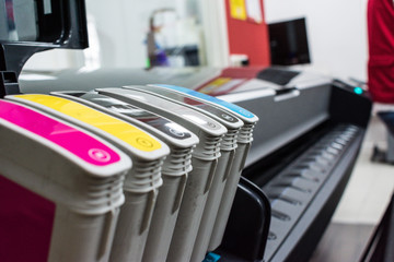 Close detail of ink cartridges in plotter for printing