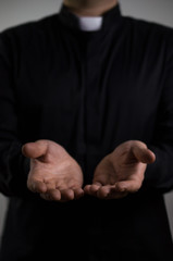 Priest giving a helping hand