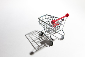 Empty shopping trolley isolated on white, closeup