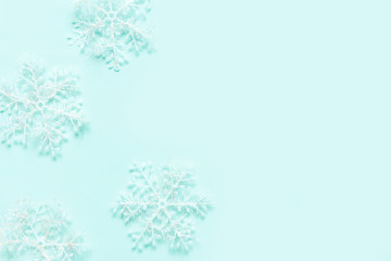 Christmas flat lay composition. Set of holiday decorations on a neo mint background, Christmas background.