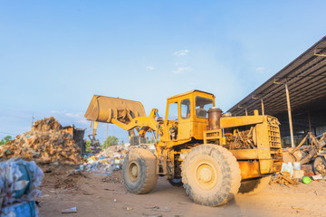 Workers sort out waste for recycling.