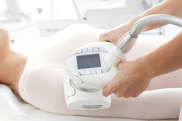 Massage endermology, vacuum massage using the head. Slimming treatment for thighs