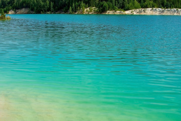 light green water ripple background, emerald lake shore