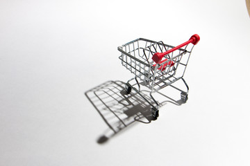 Empty shopping trolley isolated on white, closeup
