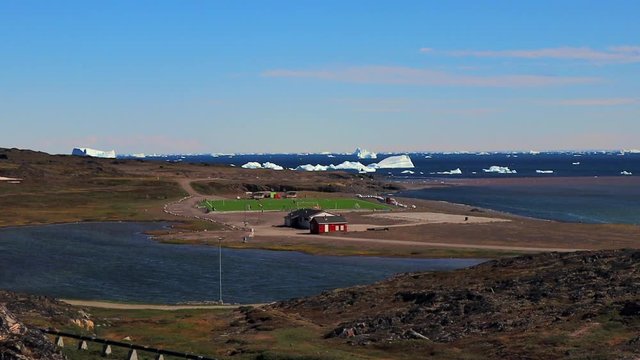 Qeqertarsuaq,Disko island football bane,and icebergs,