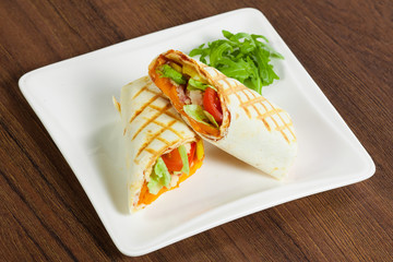 Shawarma cutted by half on white plate