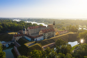 Fototapeta na wymiar Nesvizh Castle is a residential castle of the Radziwill family in Nesvizh, Belarus, beautiful view in the summer against the blue sky