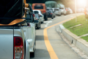 Cars parked on an asphalt road for long-distance travel or traveling.