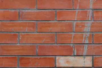 Obraz premium Orange brick with a splash of water cement float for vintage wall background and textured.