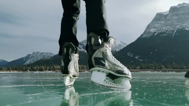 Couple skating together on a frozen lake