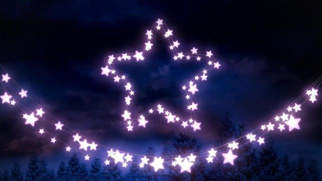 Glowing star and string of fairy lights on blue background