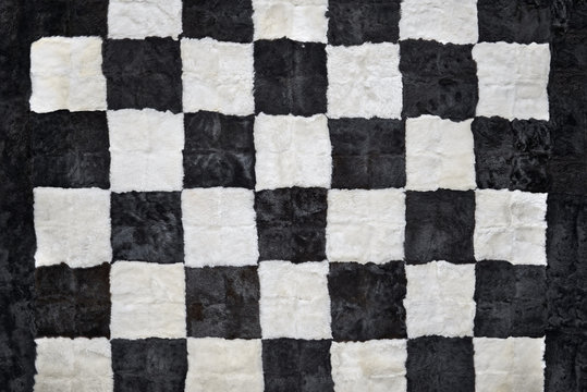 Close up of beautiful checkerboard style rug, from fur