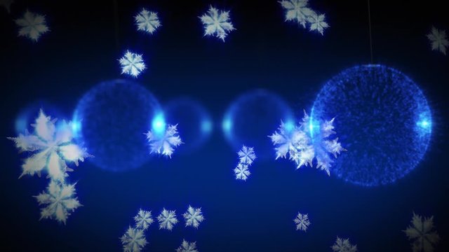 Baubles and snow falling on blue background