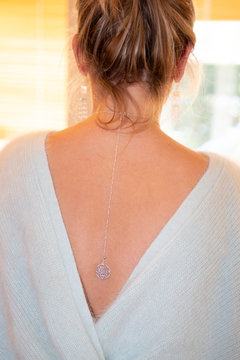 Woman Rear Sweat Behind Jewels Necklace On Her Back