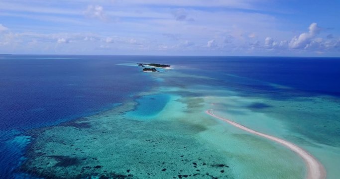 breathtaking aerial view of Belize barrier coral reef with sandbanks and uninhabited islands.