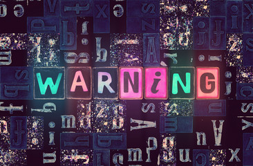 Word Warning as letters with light effect