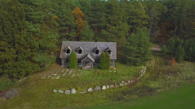 Aerial Shot of Abandoned Wooden House in the Forest. For location inquiries: simas.anuzis at gmail.com