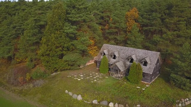 Aerial Shot of Abandoned Wooden House in the Forest. For location inquiries: simas.anuzis at gmail.com