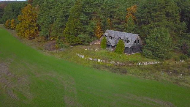 Aerial Shot of Abandoned Wooden House in the Forest. For location inquiries: simas.anuzis at gmail.com