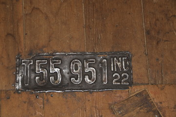 Old License Plate in Floor of Grain Bin