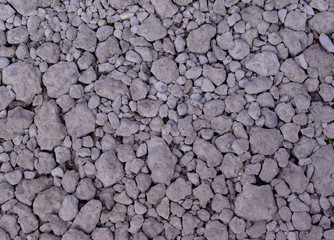 Abstract Full frame gray gravel stones image, ideal background or texture at the afternoon