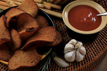 Toasts bread with garlic on a plate. Rustic style, close-up.